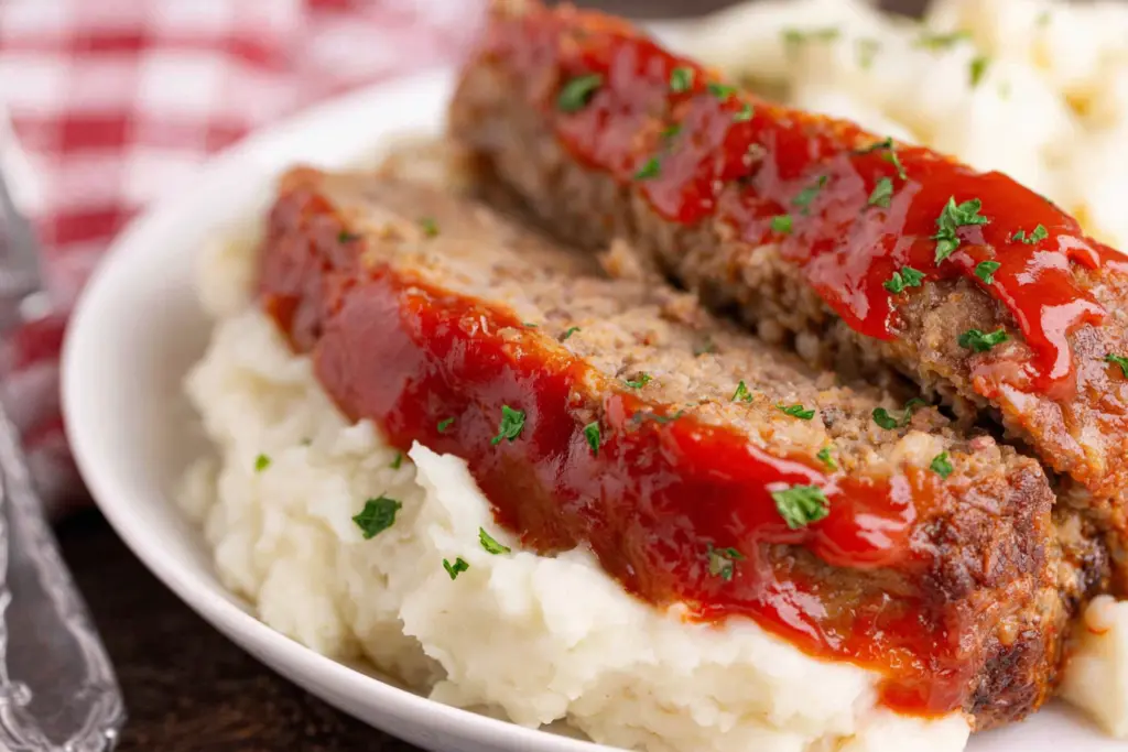serving Meatloaf with Mashed Potatoes