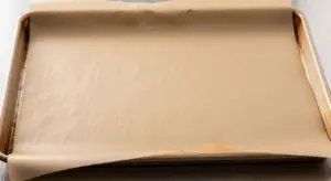 line a baking sheet with brown parchment paper.