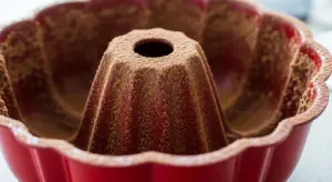 Red Velvet Bundt Cake with Cream Cheese Glaze 5 dust Bundt pan with cocoa powder