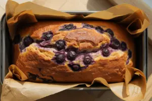freshly baked golden-brown Sourdough Discard Blueberry Bread