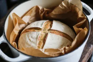 Brown Sugar Cinnamon Swirl Sourdough Bread baking in Dutch oven