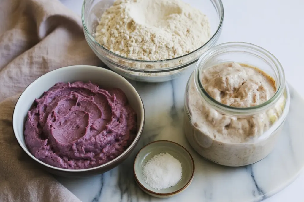 Ingredients for Sweet Potato Sourdough Bread including purple sweet potatoes and sourdough starter