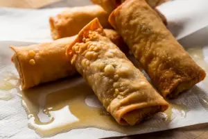 fried egg rolls drain on paper towels