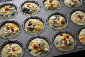 Breakfast Cottage Cheese Egg Muffins 9 cottage cheese egg muffins mixture in muffin tin cups