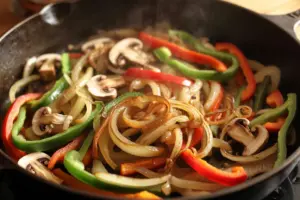 cooking bell peppers and mushrooms