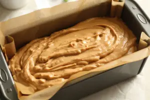 peanut butter bread batter in stander prepared loaf pan