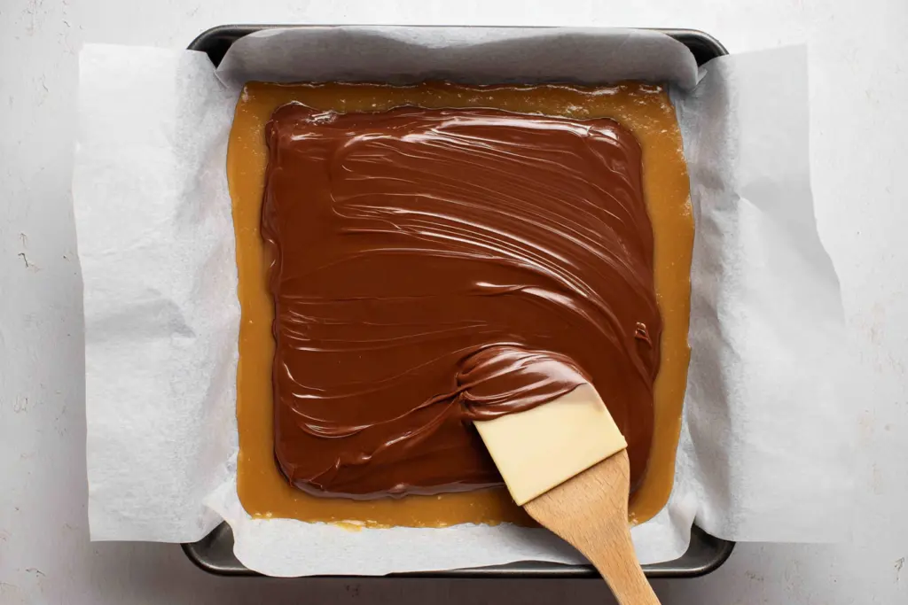 spread chocolate layer to sourdough caramel bars