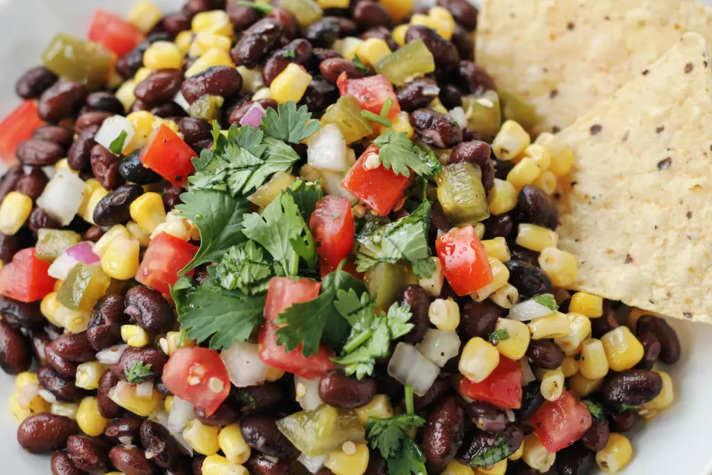 Serving black bean corn salsa with tortilla chip